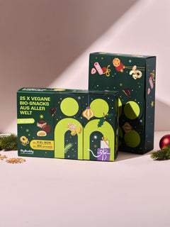 myBuddy Adventskalender 2026, BIO-VEGAN, zwei Verpackungen vor rosa Hintergrund